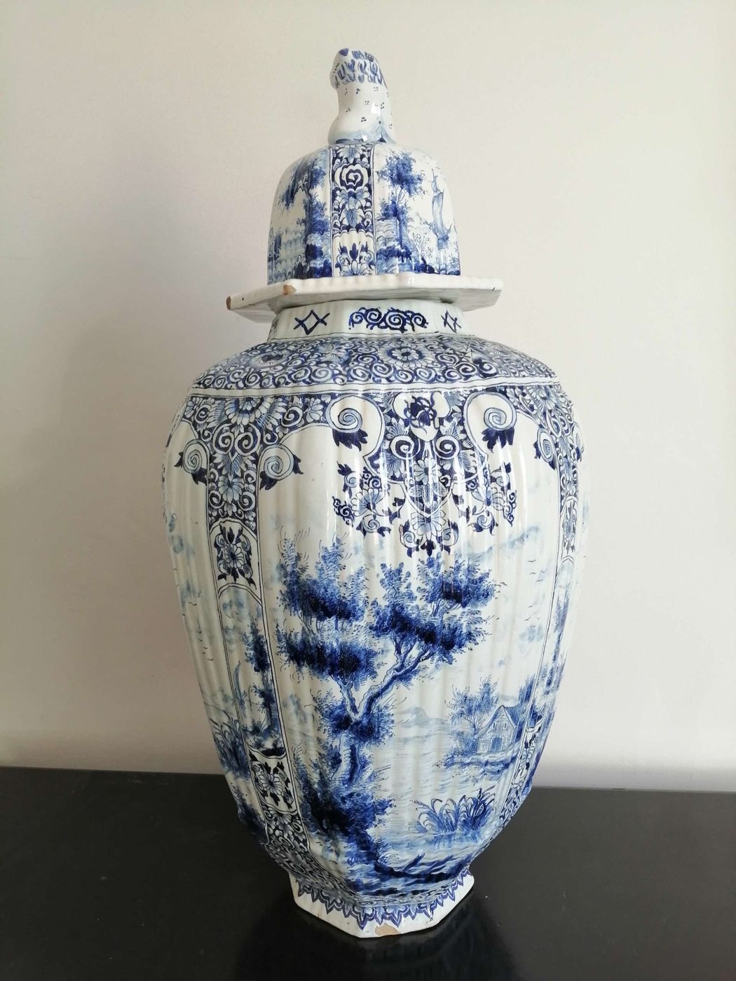 Tall blue-and-white Delft baluster vase with lion finial at Mere Antiques, Topsham